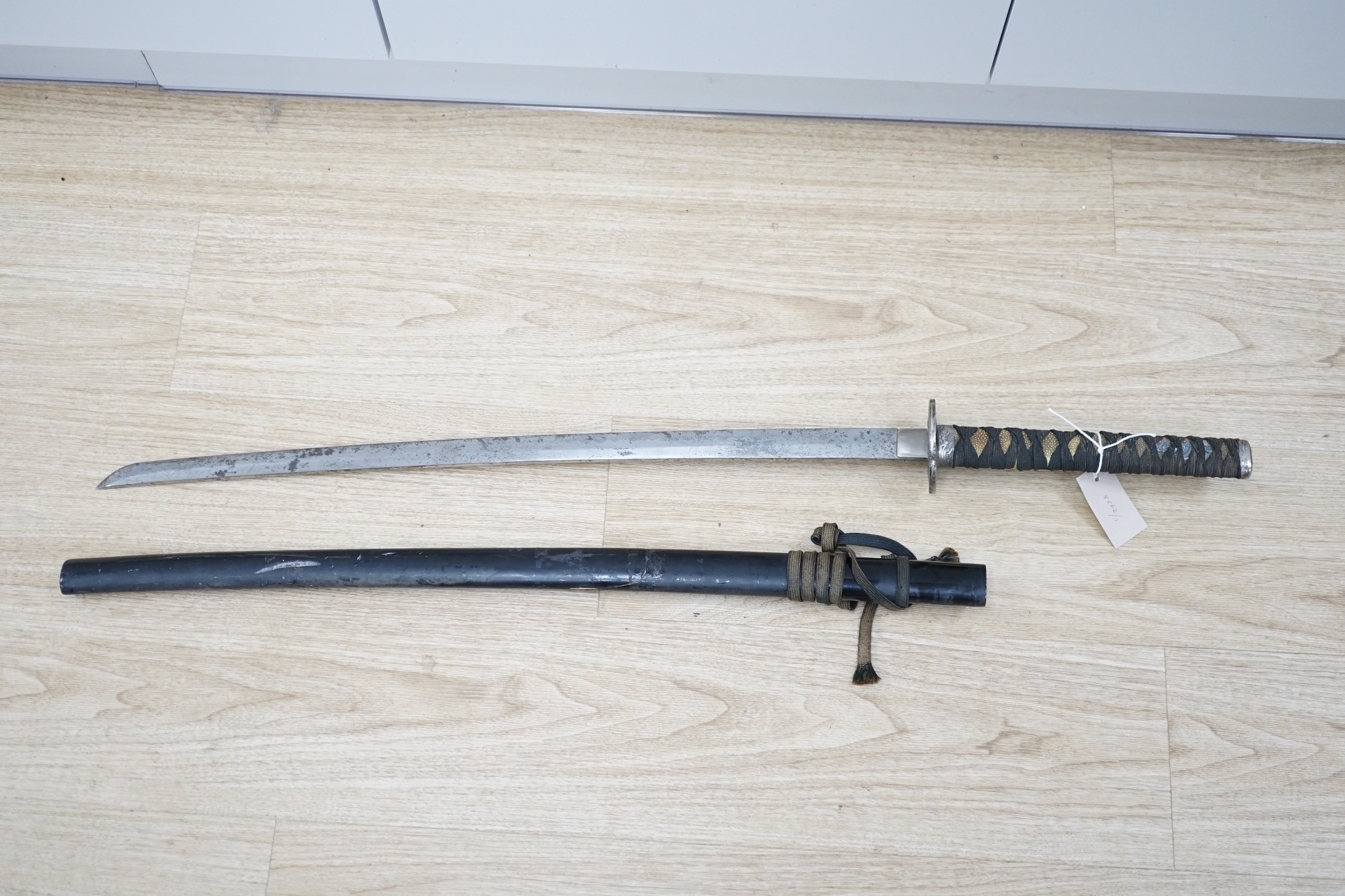 An early 20th century Japanese sword and saya, total length 102cm
